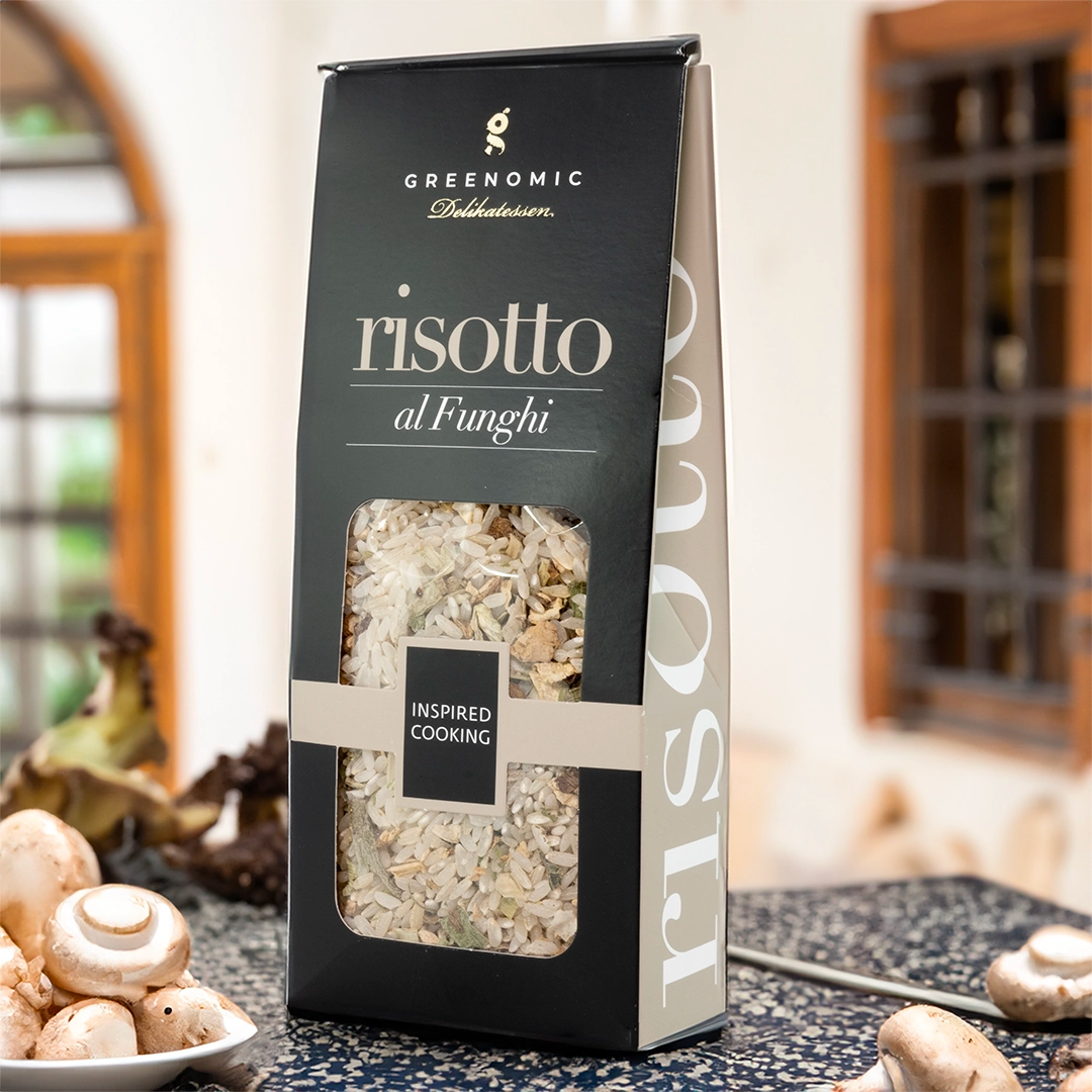 this shows the packet in a lifestyle setting in a kitchen showing a bowl of mushrooms in the foreground of the image. 