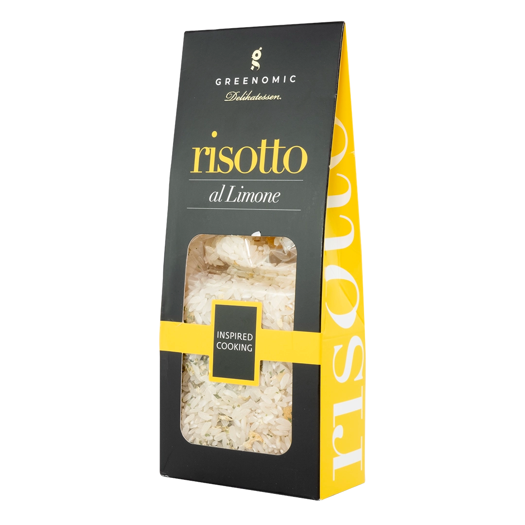 image shows a black packet with the Greenomic logo with a clear window showing the risotto rice with the title risotto al limone