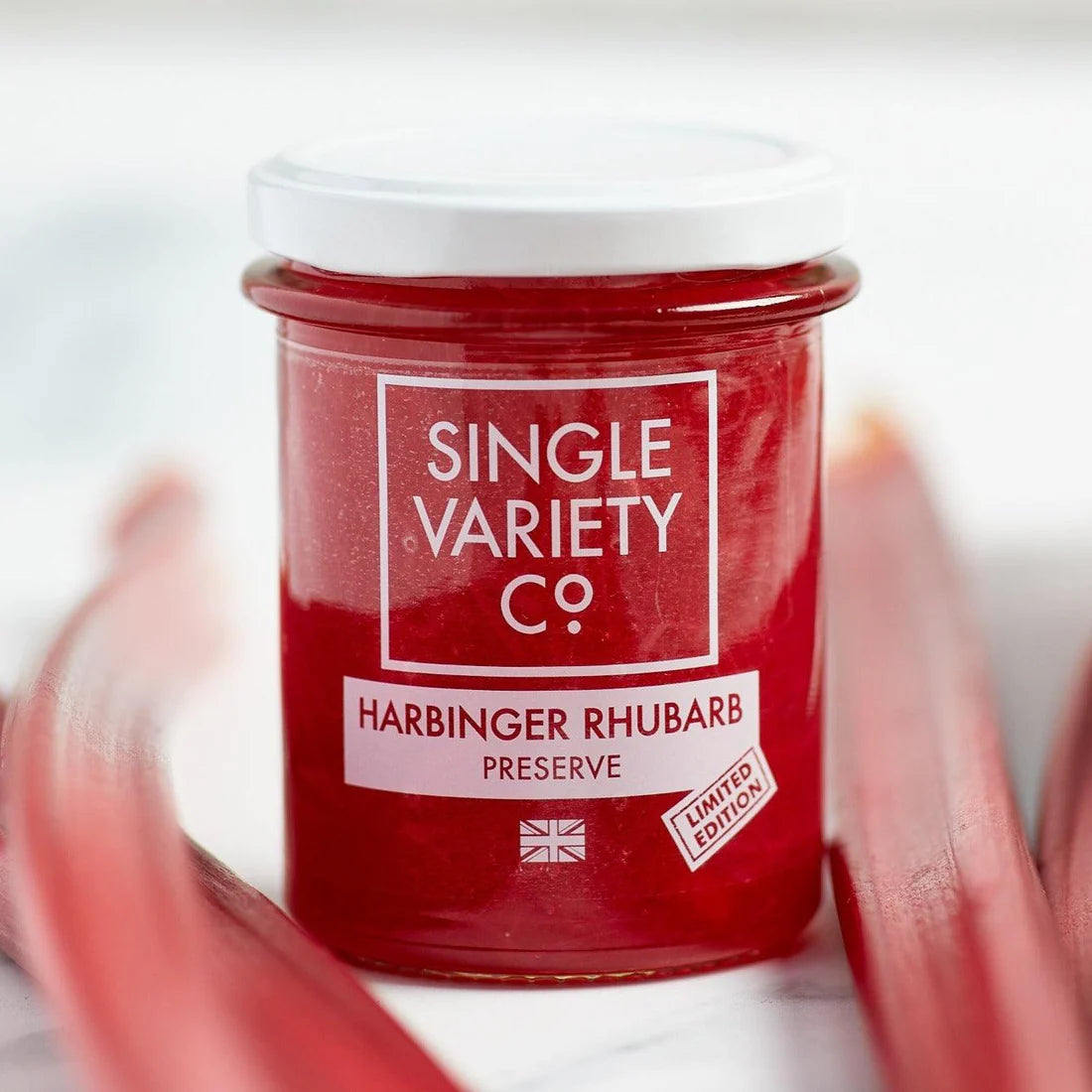 Harbinger Rhubarb Preserve surrounded by fresh rhubarb