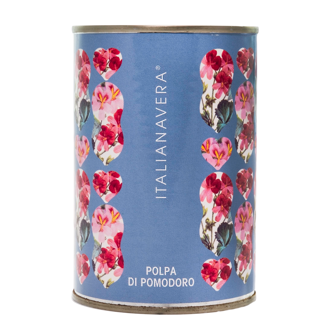Itailanavera logo on a blue tin with pink botanical flowers. 