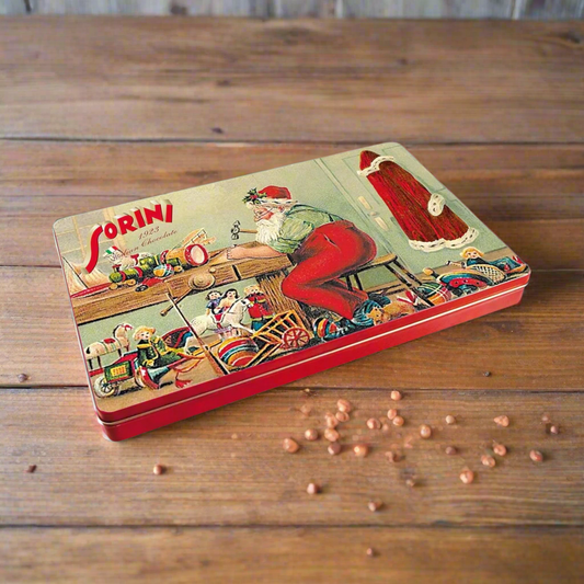 Sorini tin of chocolate on a wooden table with chocolate chips